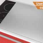 Modern Induction Cooktop Stove with Red Kitchen Furniture extreme closeup. 3d Rendering